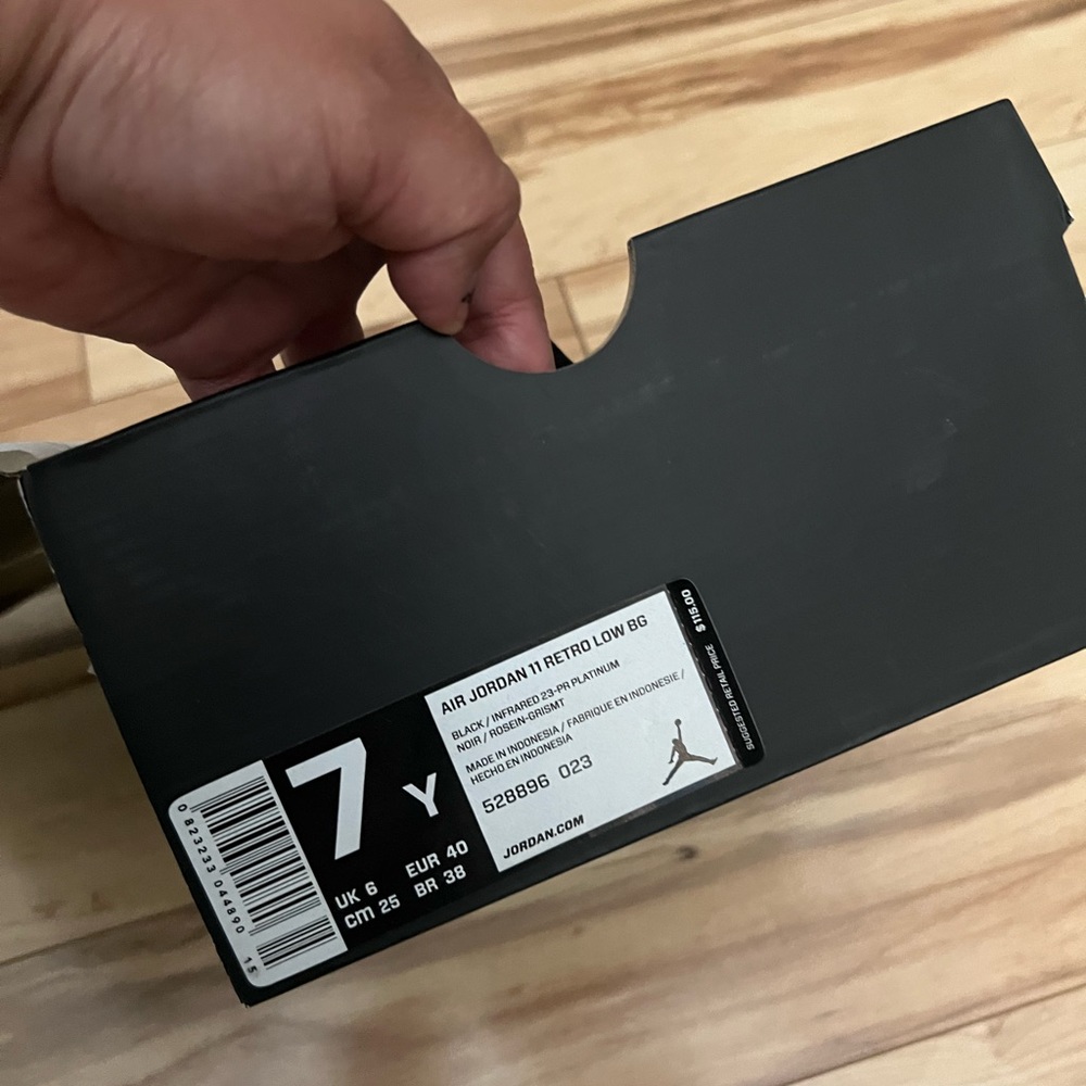 Black sneakers, waited hours to buy Jordans now I don’t have the need for them